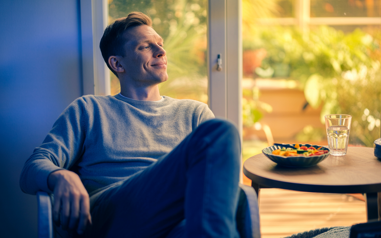 a man feeling satisified that his hunger is reduced on mounjaro