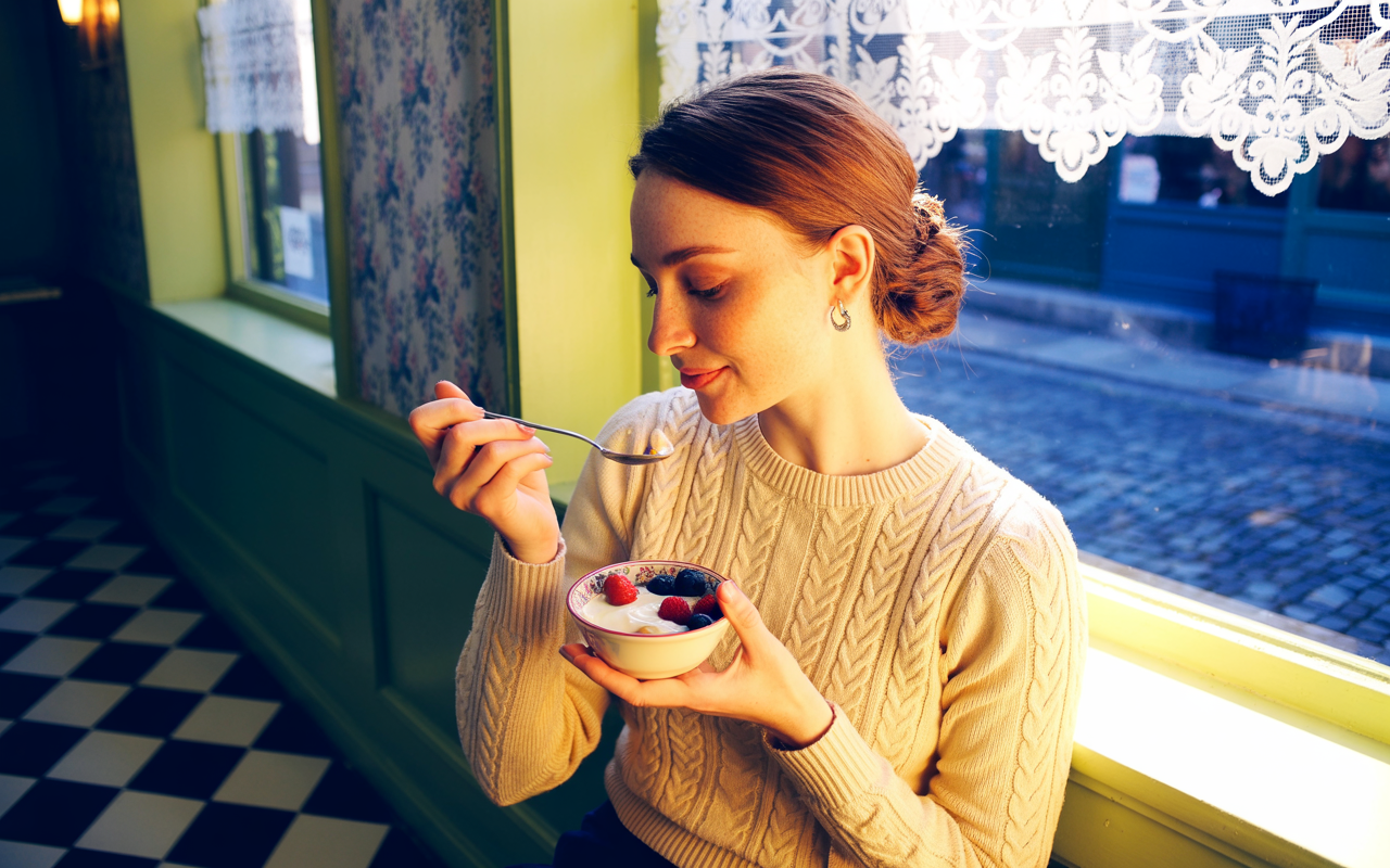 A woman eating a small healthy meal after taking wegovy