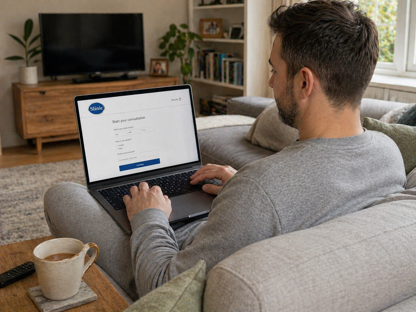 Person completing the Slinic online Mounjaro consultation from their sofa at home